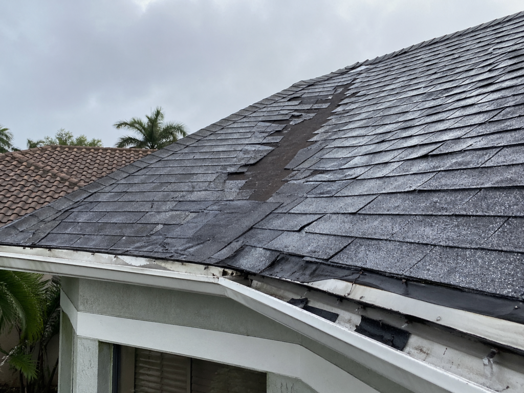 completed roof repair Oakland Park FL before and after storm damage restoration